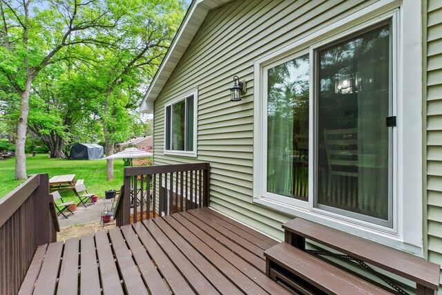 216 Richard Ave SE, Isanti, MN 55040 - wooden deck with a lawn