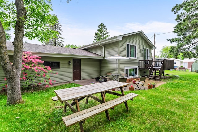 216 Richard Ave SE, Isanti, MN 55040 - rear view of house with a wooden deck, a yard, and stairway