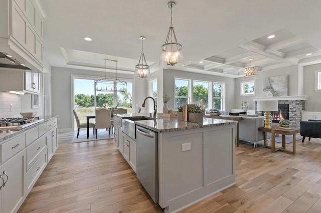 3175 Winfield Way SW, Prior Lake, MN 55372 - kitchen with appliances with stainless steel finishes, a sink, custom range hood, and light wood-style floors