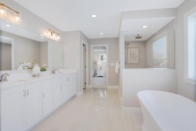 3175 Winfield Way SW, Prior Lake, MN 55372 - bathroom with a sink, baseboards, a soaking tub, and recessed lighting