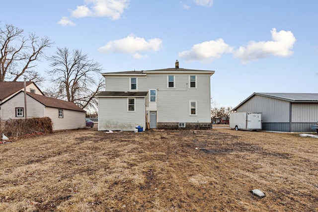107 6th Ave SE, Waseca, MN 56093 - rear view of property featuring a chimney