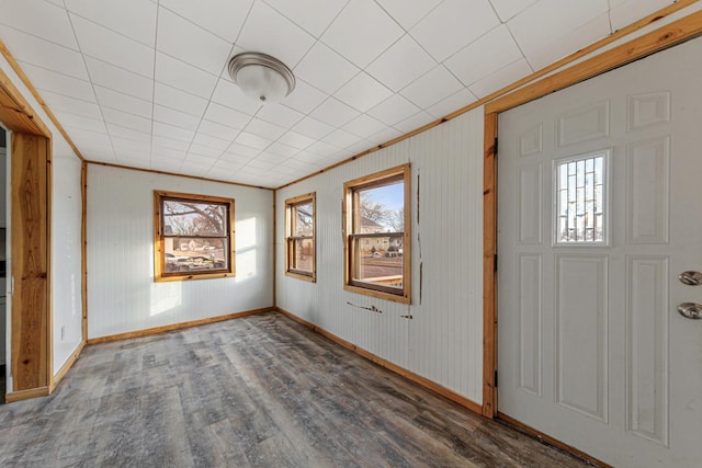 107 6th Ave SE, Waseca, MN 56093 - entryway featuring a healthy amount of sunlight, baseboards, and wood finished floors