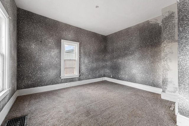 107 6th Ave SE, Waseca, MN 56093 - carpeted spare room featuring visible vents