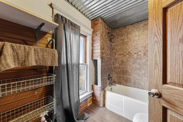 107 6th Ave SE, Waseca, MN 56093 - full bathroom with toilet, shower / tub combination, plenty of natural light, and wood finished floors