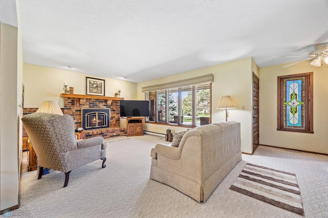 carpeted living area featuring baseboards, ceiling fan, baseboard heating, and a brick fireplace