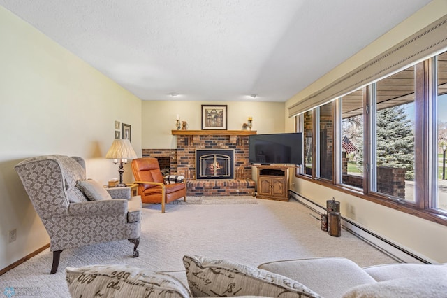living area with baseboards, a fireplace, carpet flooring, and a textured ceiling
