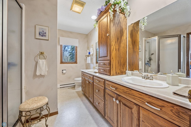 full bathroom featuring baseboards, a sink, a baseboard heating unit, and a shower stall