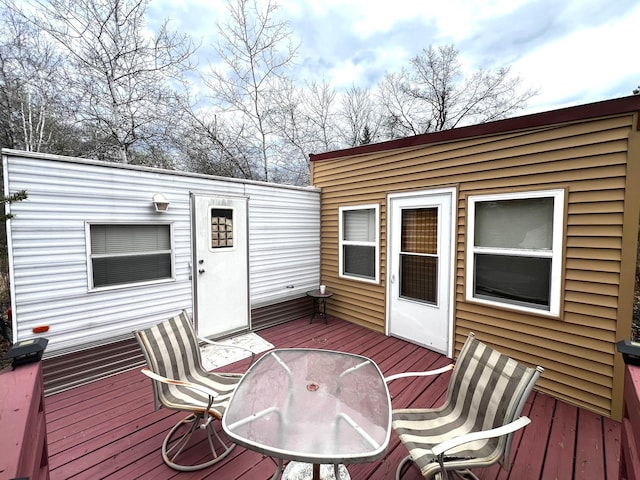 wooden deck with outdoor dining space