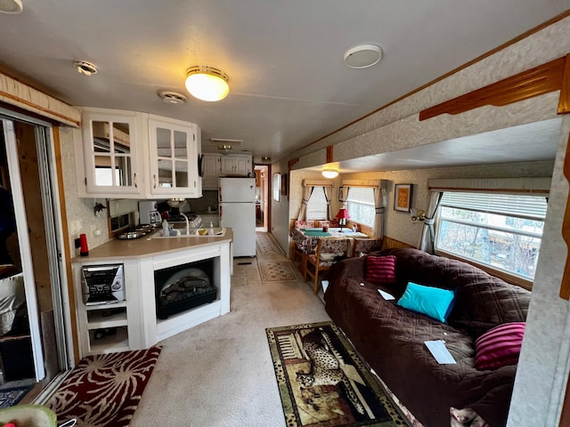 living area with light colored carpet