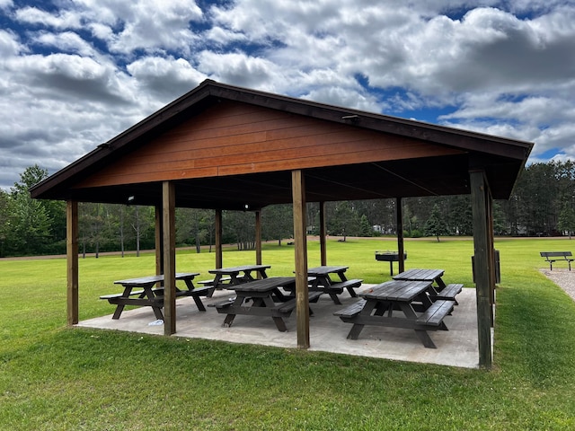 surrounding community featuring a gazebo, a lawn, and a patio area
