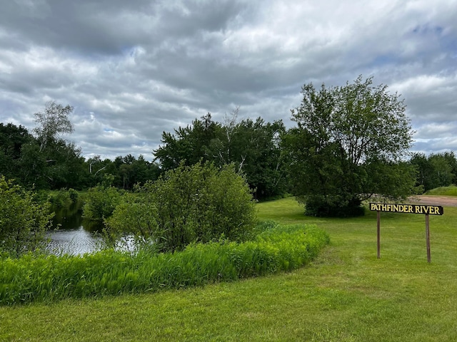 view of wooded area featuring a water view