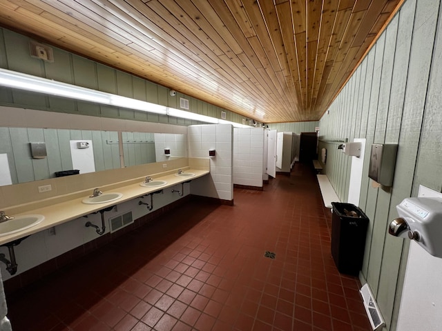 bathroom featuring wood ceiling and tile patterned flooring