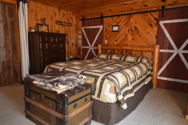 30472 Lightning Pass Unit 1, Turtle Creek Twp, MN 56443 - bedroom featuring a barn door, carpet, wood walls, and wooden ceiling