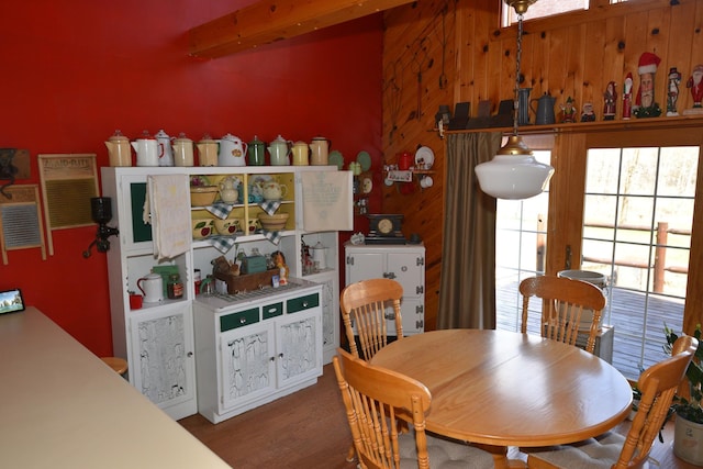 30472 Lightning Pass Unit 1, Turtle Creek Twp, MN 56443 - dining room with wooden walls, plenty of natural light, and wood finished floors