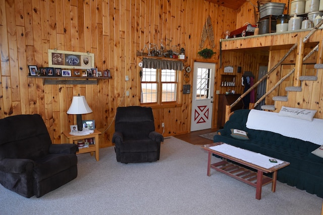 30472 Lightning Pass Unit 1, Turtle Creek Twp, MN 56443 - living area with wooden walls, carpet flooring, and stairway
