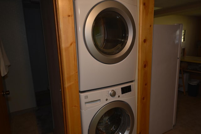 30472 Lightning Pass Unit 1, Turtle Creek Twp, MN 56443 - washroom with tile patterned floors and stacked washing maching and dryer