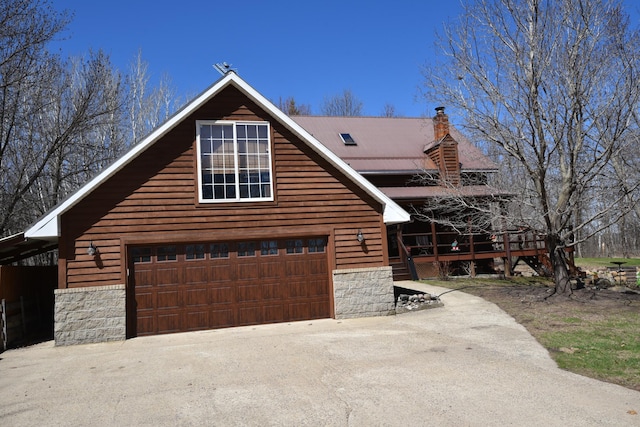 30472 Lightning Pass Unit 1, Turtle Creek Twp, MN 56443 - view of front of property featuring a garage, a wooden deck, stone siding, and a chimney