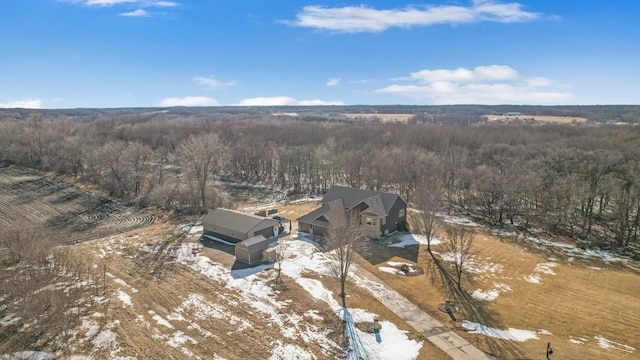 birds eye view of property with a wooded view
