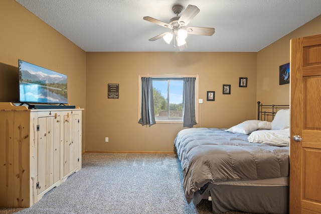 bedroom featuring carpet floors, baseboards, and a ceiling fan