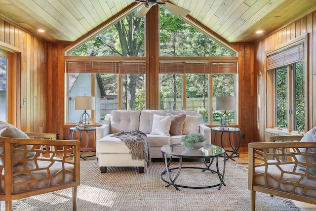1055 Nelson Dr, Shoreview, MN 55126 - living room featuring wood ceiling, wooden walls, lofted ceiling, and a ceiling fan