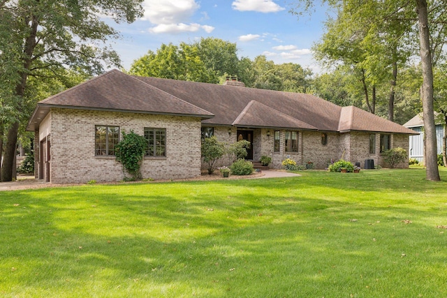 1055 Nelson Dr, Shoreview, MN 55126 - view of front of property with brick siding, a front lawn, a chimney, roof with shingles, and central air condition unit