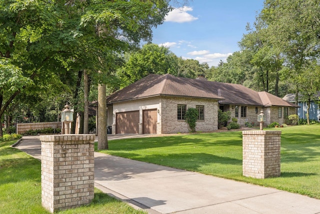 1055 Nelson Dr, Shoreview, MN 55126 - view of front of house featuring a front yard, a garage, driveway, and a chimney