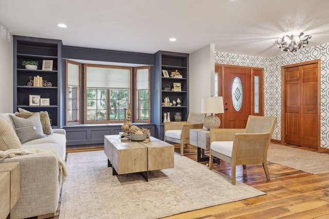 1055 Nelson Dr, Shoreview, MN 55126 - living area with wallpapered walls, wood finished floors, and recessed lighting