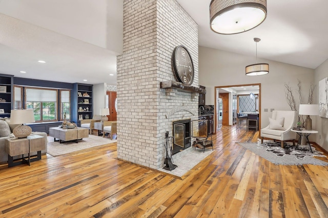 1055 Nelson Dr, Shoreview, MN 55126 - living room with light wood-style flooring, high vaulted ceiling, a fireplace, and wine cooler