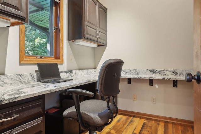 1055 Nelson Dr, Shoreview, MN 55126 - office featuring built in desk, wood finished floors, and baseboards