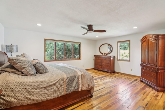 1055 Nelson Dr, Shoreview, MN 55126 - bedroom featuring light wood finished floors, baseboards, recessed lighting, and ceiling fan