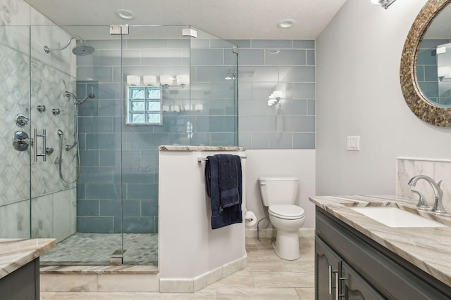 1055 Nelson Dr, Shoreview, MN 55126 - bathroom featuring vanity, a stall shower, toilet, and marble finish flooring