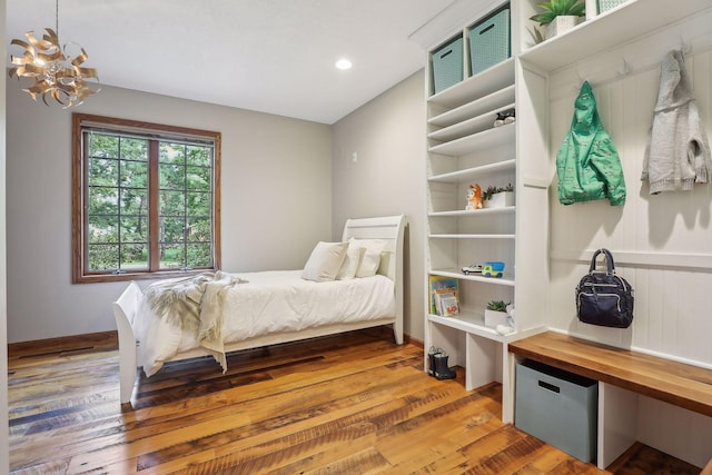1055 Nelson Dr, Shoreview, MN 55126 - bedroom featuring wood finished floors, a chandelier, recessed lighting, and refrigerator