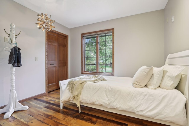 1055 Nelson Dr, Shoreview, MN 55126 - bedroom featuring a chandelier, wood finished floors, and baseboards