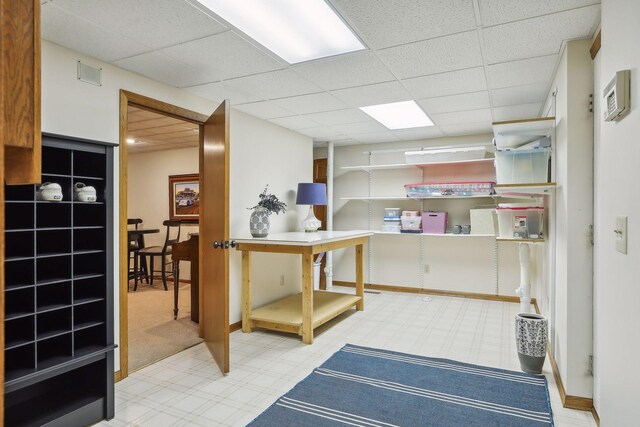 1055 Nelson Dr, Shoreview, MN 55126 - basement featuring a drop ceiling, carpet, and baseboards