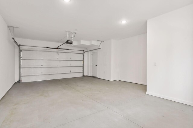 garage featuring recessed lighting and a garage door opener