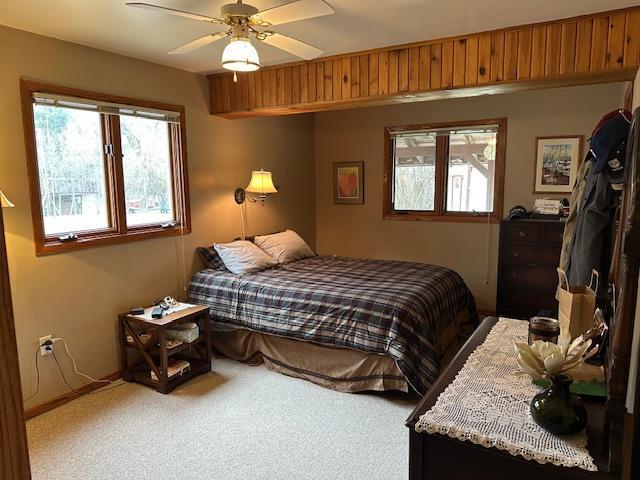 9700 Aspen Ave NW, Bemidji, MN 56601 - bedroom featuring ceiling fan and light carpet