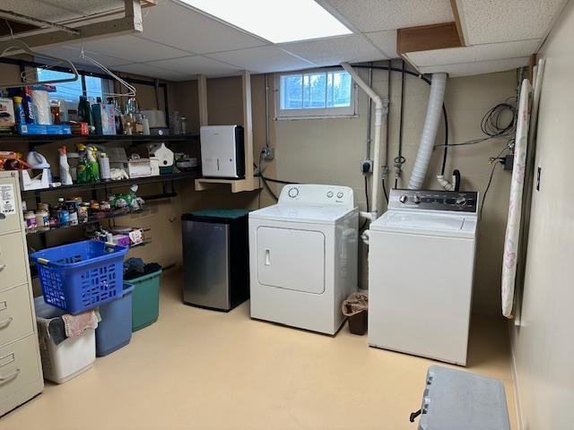9700 Aspen Ave NW, Bemidji, MN 56601 - washroom with laundry area and washer and clothes dryer