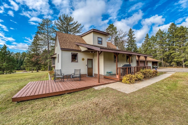 9700 Aspen Ave NW, Bemidji, MN 56601 - rear view of property with a shingled roof, a yard, and a deck