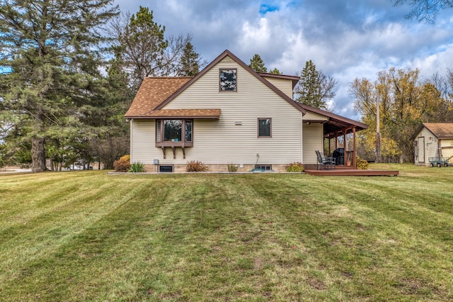 9700 Aspen Ave NW, Bemidji, MN 56601 - rear view of house featuring a yard, a deck, and a shingled roof