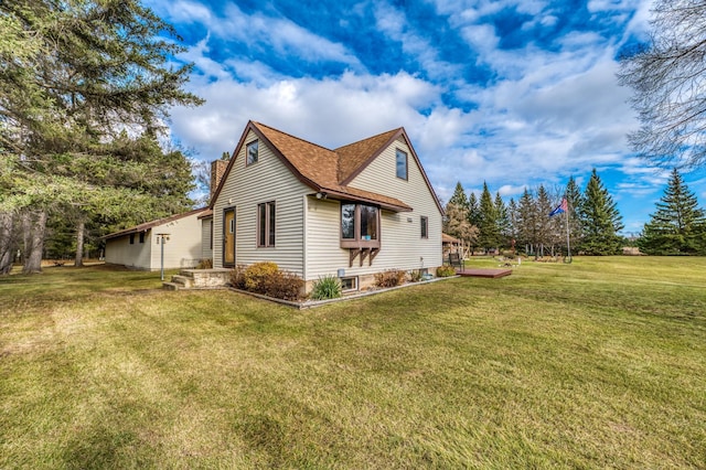 9700 Aspen Ave NW, Bemidji, MN 56601 - view of side of home with roof with shingles and a yard