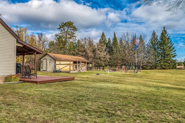 9700 Aspen Ave NW, Bemidji, MN 56601 - view of yard with fence, an outdoor structure, and a deck