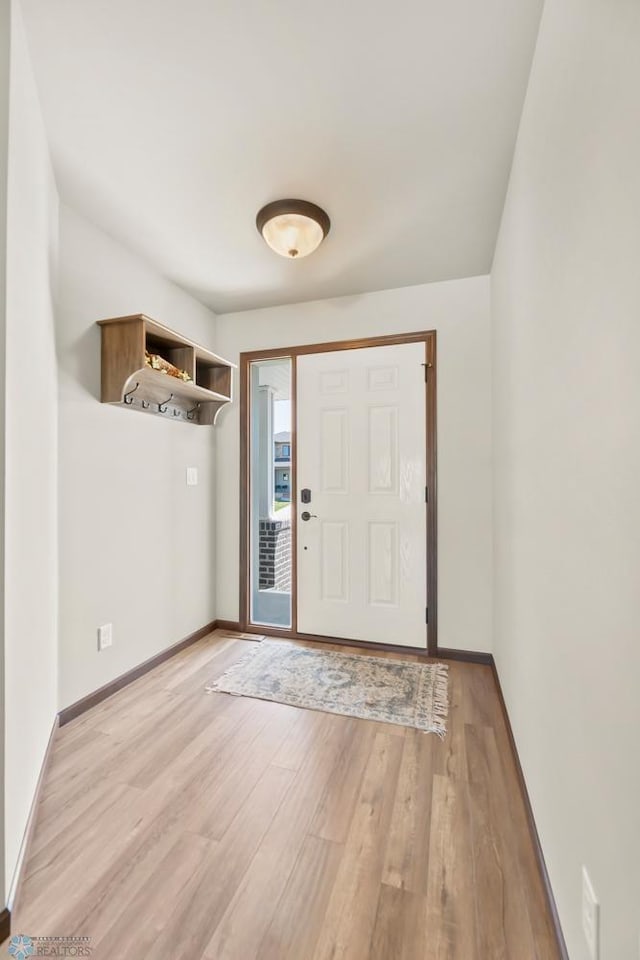 entrance foyer featuring light wood-style floors and baseboards