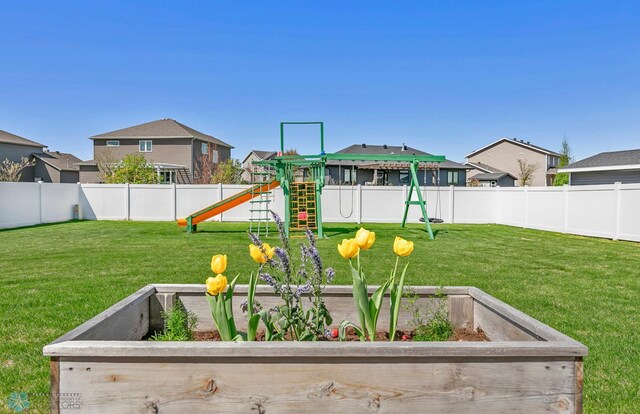 view of play area with a residential view and a garden