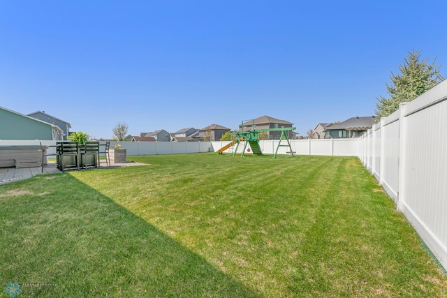 view of yard with a playground and a residential view