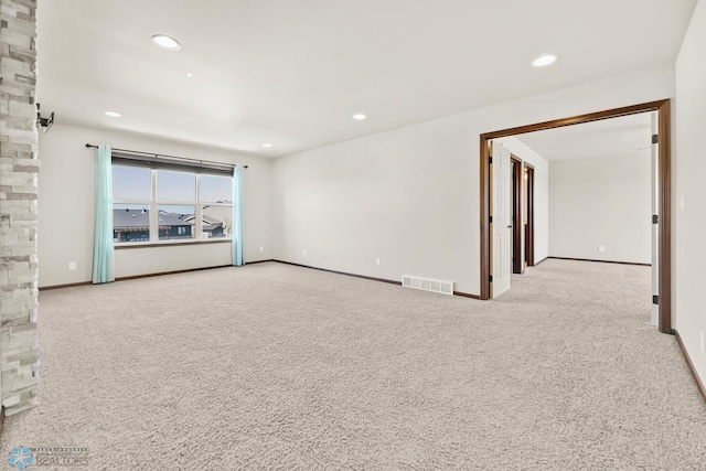 carpeted empty room with recessed lighting and baseboards