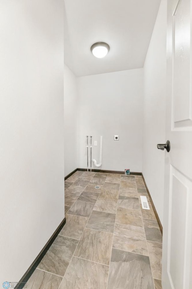laundry room featuring electric dryer hookup, baseboards, and washer hookup