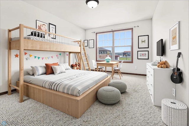 carpeted bedroom featuring baseboards