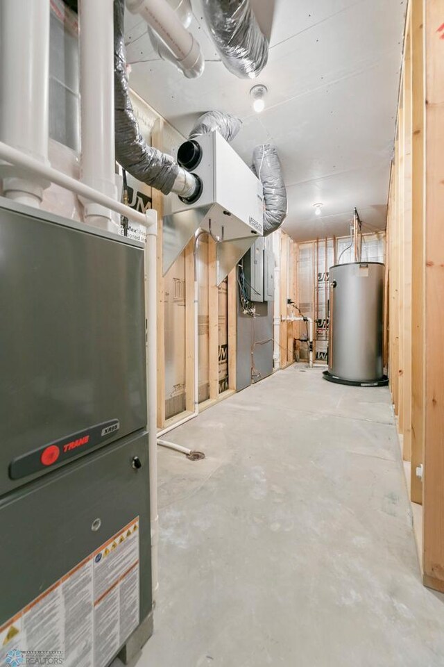 unfinished basement featuring gas water heater