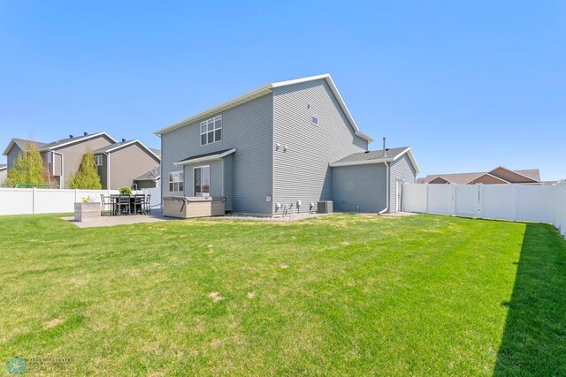 back of house featuring a patio, a hot tub, and cooling unit