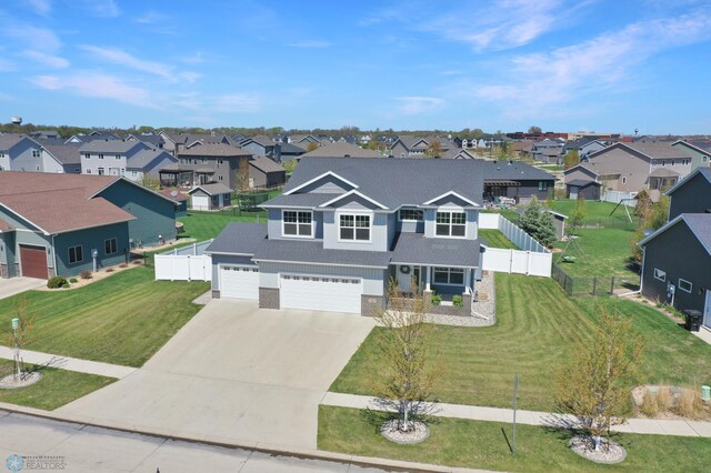 view of front of house with a residential view, concrete driveway, roof with shingles, and an attached garage
